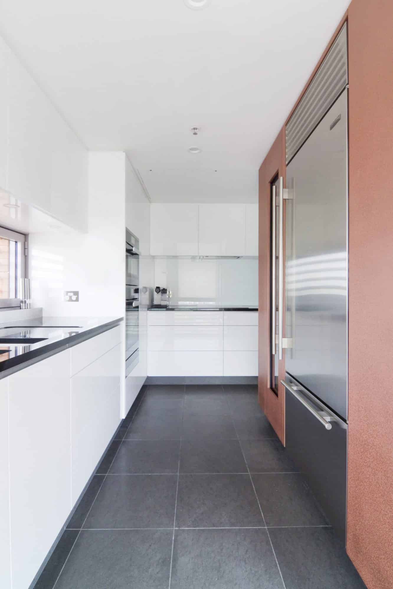 White minimalist kitchen in a luxury Sydney apartment