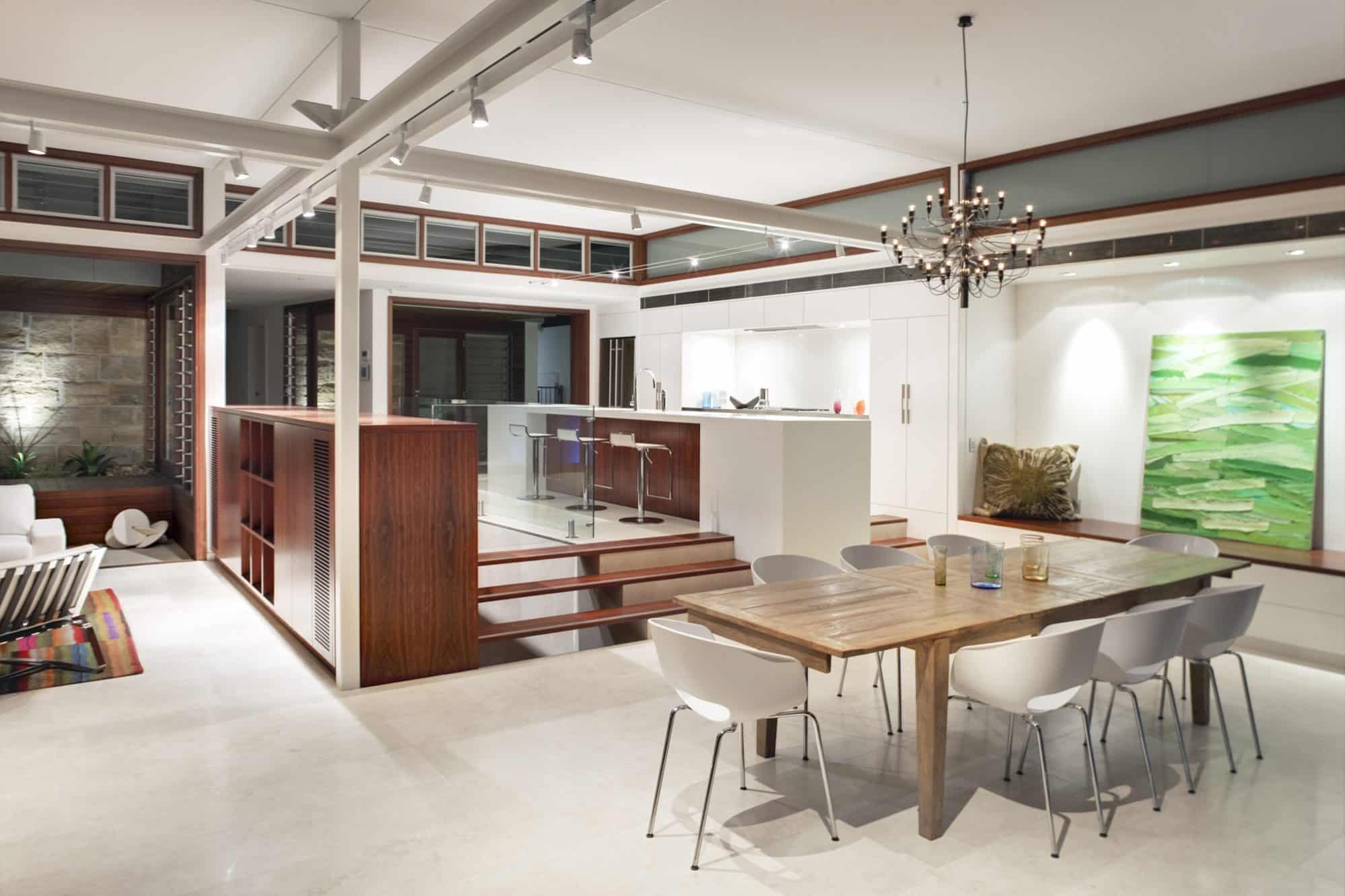 The kitchen sits within the corner of a large open plan room